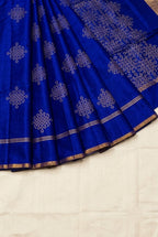 Royal blue soft silk saree decorated with traditional South Indian kolam motifs